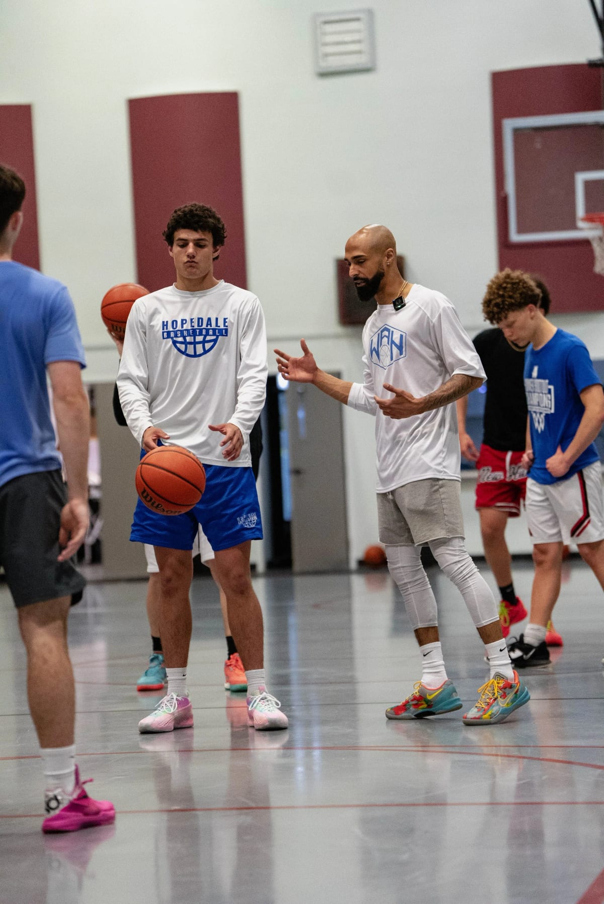 Coach Aaron Anniballi working one on one with a player on ball handling